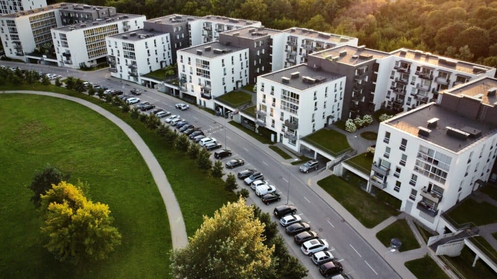 Aerial view of Canadian condo buildings near a park, used on a condo owners website to illustrate a modern community hub for notices, bylaws, minutes, and owner access.